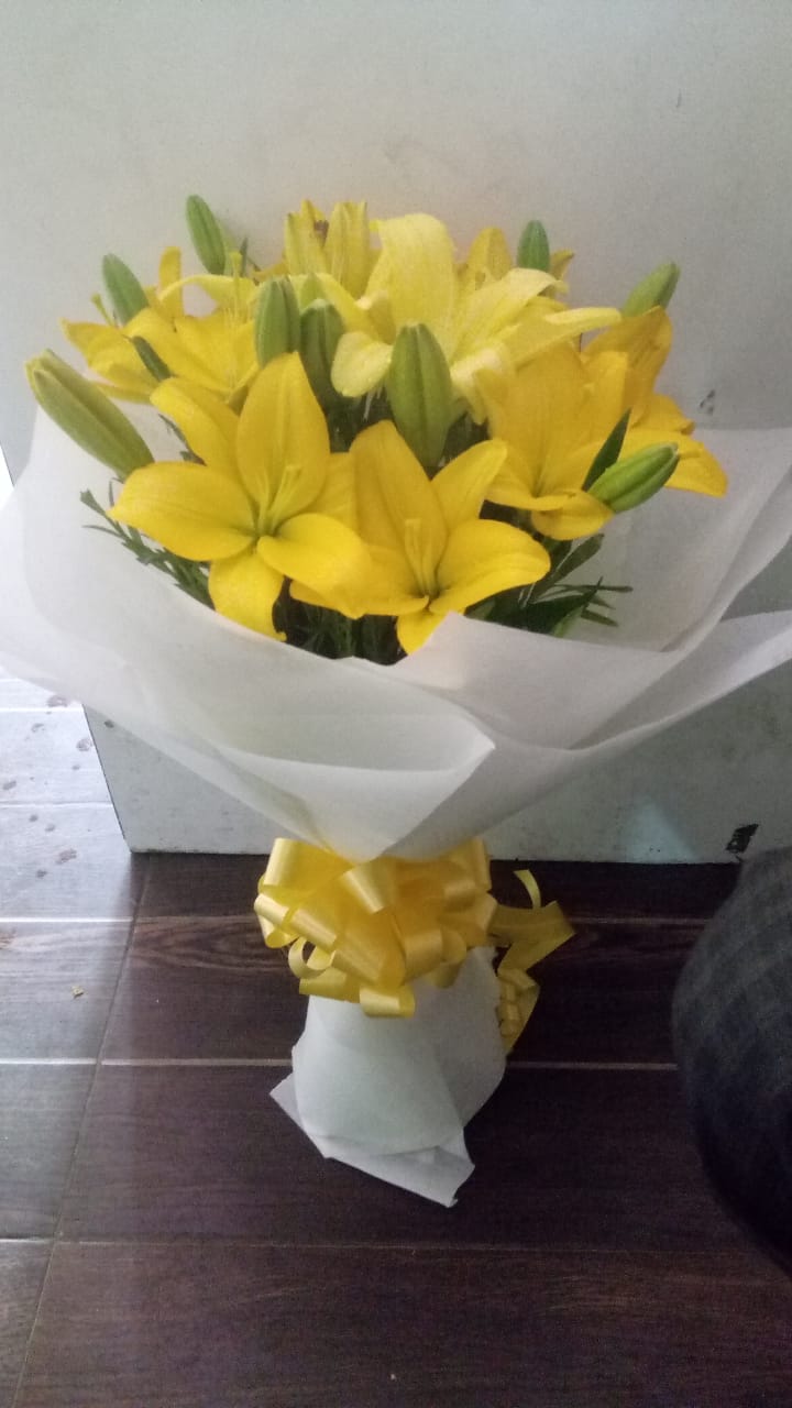 Yellow Asiatic Lilliums in White Paper
